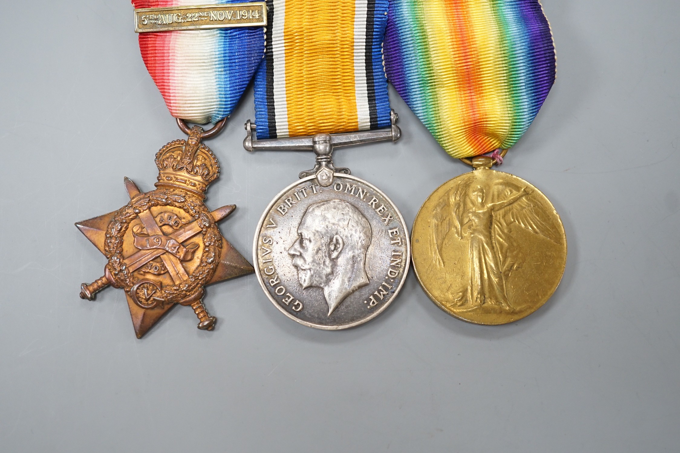 A WWI Mons star (with bar) trio to 3885 PTE. T. BRADY IR. GDS.